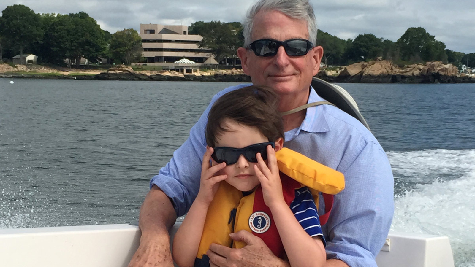 Peter Moore with a child on a boat